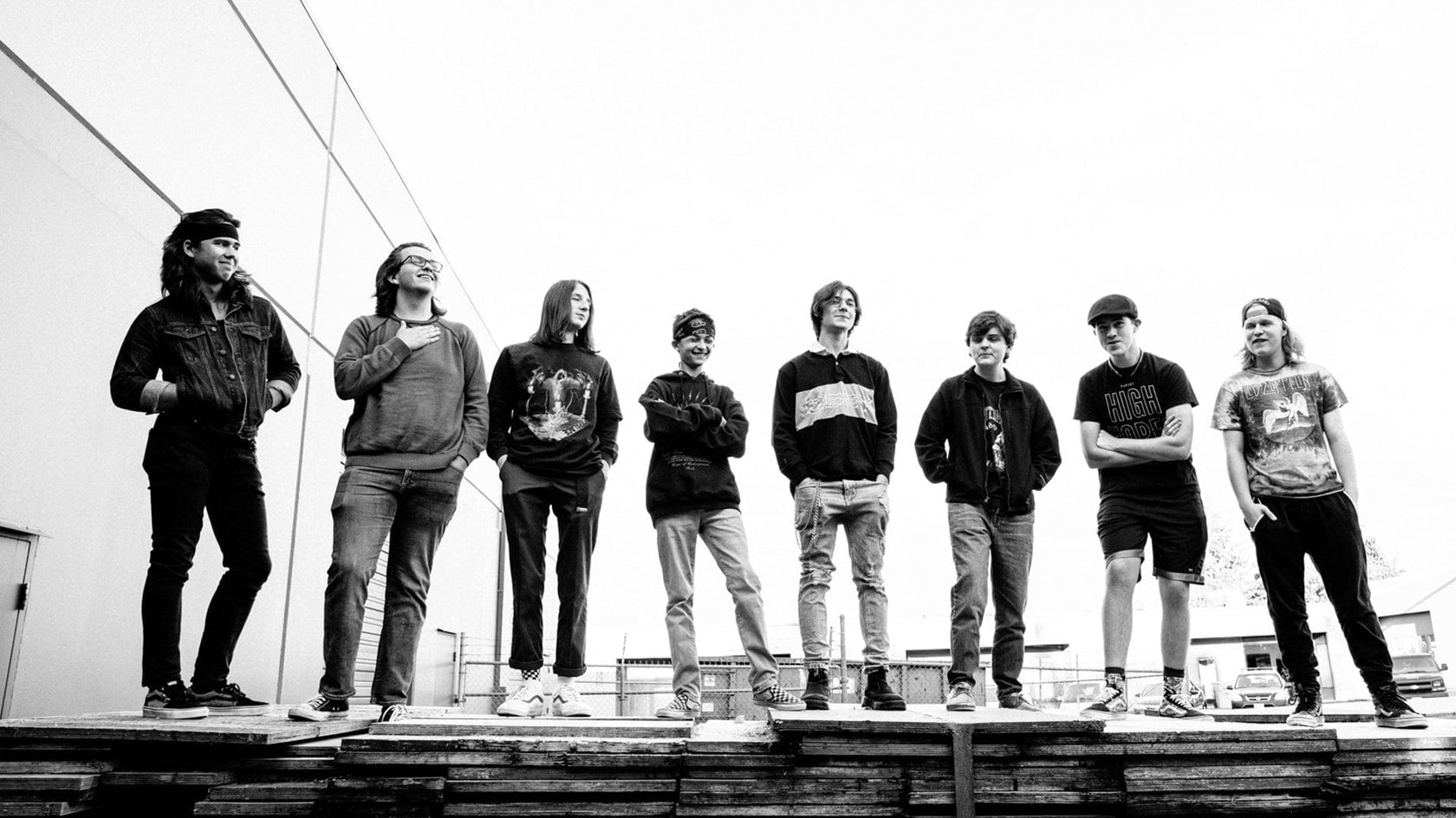 A group of royal rockers age 14 - 20. They are posing outdoors for a picture with the whole crew.